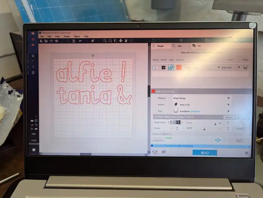 picture of computer screen showing vinyl cutting software, showing text "alfie ! tania &"